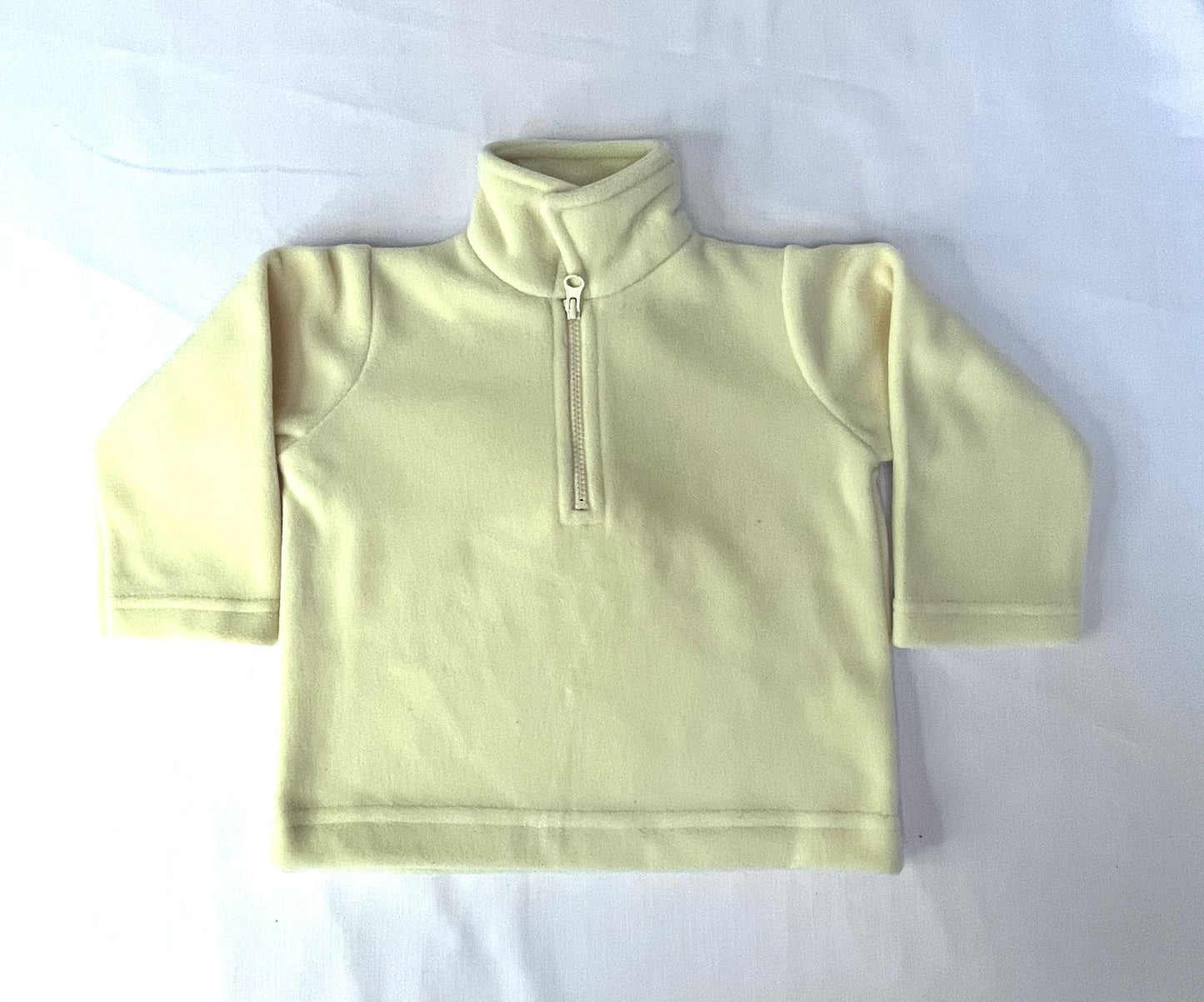 Light yellow long sleeve kids jacket. 6-12 months.